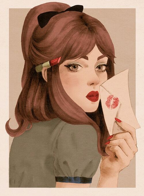 おすすめの口紅を封筒につけている女性の画像